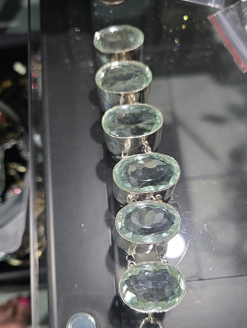 Silver Bracelet with Light Green Faceted Stones